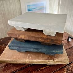 three wooden boards stacked on top of each other