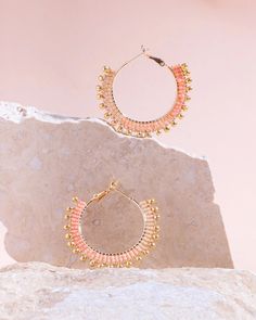 These beaded hoop earrings combine delicate premium Japanese Miyuki glass beads with gold drop accent beads for a fun and whimsical everyday hoop. Three ombre tones of beads are woven one bead at a time around a gold-filled hoop base with a lever back closure for easy on and off use. Our earrings are handmade by women artisans in Medellin, Colombia who receive fair working conditions and compensation for their skills. Materials: Miyuki Glass Beads Gold Filled Hoop Earring Base Size: Length 1.5 I Gold Hoop Earrings With Tiny Beads For Summer, Gold Beaded Hoop Earrings For Summer, Summer Tiny Beads Small Hoop Earrings, Summer Tiny Beaded Small Hoop Earrings, Trendy Small Hoop Beaded Earrings With Tiny Beads, Trendy Gold Beaded Earrings With Colorful Beads, Trendy Gold Beaded Earrings With Dangling Beads, Summer Dangle Hoop Earrings With Tiny Beads, Trendy Gold Hoop Earrings With Colorful Beads