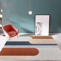 a room with a rug, chair and lamp on the floor in front of it