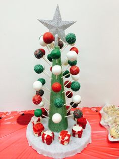 a christmas tree made out of cupcakes and candy