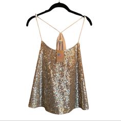 Sold By American Threads Boutique Brand: Alythea Gold Sequin Trapeze Tank Racerback Formed By 2 Silky Spaghetti Straps(Not Adjustable) Unleash Your Inner Disco Queen In This Modern Take On A Classic Studio 54 Ensemble. Style Under A Blazer For Work Or W/Your Fav Mini & Faux Fur Coat For A Glamorous Date Night Look. This Cut Is Super Flattering! Front&Back Covered In Sequins Straps/Lining Satin(Poly) Approx Meas. Pit-Pit: 18.25” Unstretched (21.5”) L: 22.5” Imo Fits Us 6-10 Depending On How You W Glamorous Sleeveless Top With Built-in Bra, Backless Party Top With Straps, Chic Party Tops With Straps, Sequin Halter Neck Top For Summer, Sequin Spaghetti Strap Camisole For Spring, Spring Sequined Spaghetti Strap Camisole, Summer Halter Neck Top With Sequins, Summer Sequin Halter Neck Top, Spring Camisole With Sequins And Spaghetti Straps