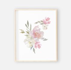 a pink and white floral print hanging on a wall