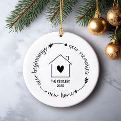 a personalized ornament hanging from a christmas tree