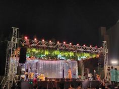 an outdoor stage set up for a wedding reception