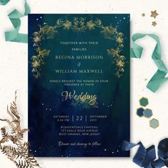 a wedding card with gold foil and blue watercolors on it, surrounded by confetti