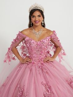 You'll love twirling around in this 3D floral applique long off the shoulder cape dress with A-line skirt by House of Wu 26052. Off-the-shoulder neckline with sequin lace appliqués and sparkle tulle ball gown skirt. Has a lace-up back and train. The detachable cape is included - giving you a versatile second look! House of Wu Quinceanera Collection Spring 2023 Style Number: 26052 Fabric: Tulle/Sequin Lace Appliques/3D Floral Appliques Please note: There may be a loss of glitter while wearing thi Quince Planning, Era Dresses, Floral Cape, Watteau Train, Quinceanera Collection, Detachable Cape, Debutante Ball, Tulle Balls, Big Dresses