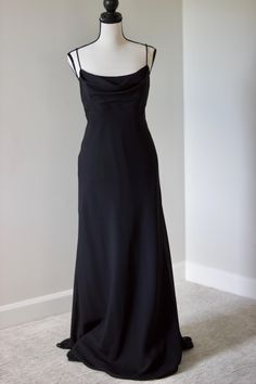 Elevate your style with this chic vintage Y2K black maxi dress, featuring a sophisticated cowl neckline. Perfect for evening events and special occasions, this dress exudes timeless elegance and effortless grace. Embrace the classic fashion of the early 2000s with this versatile and stylish piece. Add this stunning vintage dress to your collection for a touch of retro charm and modern sophistication. Fits a size medium.  Message for measurements. Chic Y2k, The Early 2000s, Vintage Elegance, Y2k Black, Cowl Neckline, Black Maxi, Chic Vintage, Classic Fashion, Early 2000s