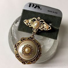 Sd2 Vintage New Stock1928 Brooch. It Has A Dangling Picture Locket. Faux Pearls. Never Worn. But By Storing Long Years, The Plastic Back Card Has Half Broken And The Back Of Locket Has Some Light Scratches & Light Tarnish Shown. Very Pretty!! I Don't Polish Item & Just Send As Is. You Can Polish Whenever You Wish Price Is Firm Item Only (Unless I Mention Abt Packaging Or Tag) But Wrapping Safely Enlarge/See Pics To Check Size & Condition All Sales Are Final. Please See All Pics Lf Any Questions, Vintage 1928 Jewelry, Picture Locket, 1928 Jewelry, Brooch Necklace, Locket, Faux Pearl, Brooches, Vintage Jewelry, Crown Jewelry