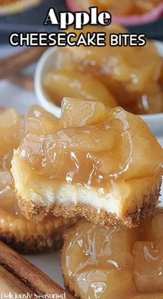 apple cheesecake bites on a plate with cinnamon sticks