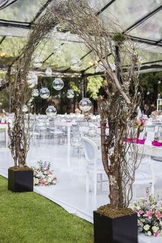 an outdoor wedding venue with tables and chairs