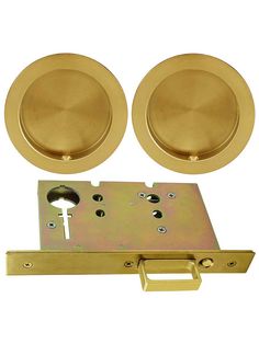 two round knobs and one door handle are shown in gold metal with the latch open