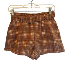 High Waisted Shorts In A Wide Wale Plaid Corduroy With Slight Stretch. Flat Front, Adjustable Belt, And Side Slant Pockets. 97% Cotton, 3% Spandex. Waist: 26" Rise: 11.5" Inseam: 2" Style# Mp9214-4 Brown Plaid Shorts, Bee Costumes, High Waisted Floral Shorts, Gingham Jacket, Lace Trim Shorts, Spelling Bee, Striped Bags, Corduroy Shorts, Fabulous Clothes