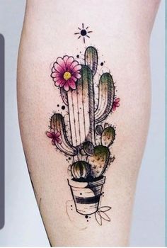 a woman's thigh with a cactus and flower tattoo on it