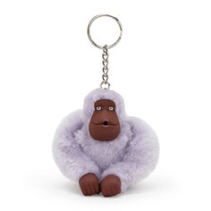 a stuffed animal keychain with a gorilla face on it's chest and legs