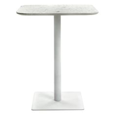 a white table with a marble top and metal base, on a white background stock photo