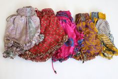 "Our cute new shorts made for gorgeous recycled vintage Indian silk mix sari This amazing style has drawstrings on both legs, so that they can be gathered and shortened to reveal as much leg as you want They also have an elasticated waist and ruffle that can fit a range of sizes Perfect for summer and days where you just want to lounge SIZES DETAILS  WAIST=38\" LENGTH=10\" WAIST-BAND=3\"" Bohemian Shorts With Elastic Waistband, Bohemian Shorts With Elastic Waistband For Festivals, Bohemian Festival Shorts With Elastic Waistband, Festival Shorts With Elastic Waistband, Baggy Shorts, Shorts Summer, Night Wear, Vintage Indian, Silk Shorts