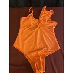 Edelqual Women's Size M One Piece Bright Orange Swimsuit. Trendy Sleeveless Pool Bodysuit, Sleeveless Cutout Bodysuit For Beach Season, Sleeveless Bodysuit With Cutout For Beach Season, Casual Stretch Bodysuit With Cutout, Casual Orange Sleeveless Bodysuit, Casual Sleeveless Orange Bodysuit, Casual One Piece For Pool, Summer Sleeveless Cutout Bodysuit, Casual Stretch One Pieces For Spring