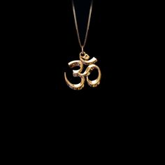 Connect with the sacred sound of the universe with our gold Om pendant, finely crafted in the USA. Representing the essence of ultimate reality, consciousness, and inner peace, each piece is a harmonious blend of spirituality and artistry. PENDANT INFORMATIONThis pendant is made of real, solid gold.• Made in USA• Size: MINI• Material: 14k or 18k solid gold• Finish: polished• Height: 0.9" (22,5 mm) x Width: 0.85" (22 mm)• Pendant weight (approx.): 3,5 grams (14k)• Bail: fits up to 4 mm chains• So Yellow Gold Spiritual Necklace With Si Clarity, Spiritual Yellow Gold Jewelry For Meditation, Spiritual Gold Jewelry For Meditation, Symbolic Jewelry With Large Pendant For Healing, Yellow Gold Spiritual Necklaces For Meditation, Spiritual Ceremonial Jewelry With Round Pendant, Spiritual Yellow Gold Necklaces For Meditation, Spiritual Yellow Gold Necklace For Meditation, Symbolic Ceremonial Jewelry For Festivals