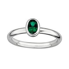 Bezel-set, oval-cut, lab-created emerald stone emits luminous green hues. Details:  1/4-in. width Rhodium-plated sterling silver  Size: 5. Gender: female. Age Group: adult. Sterling Silver Stackable Emerald Ring As Gift, Stackable Sterling Silver Emerald Ring, Oval Stackable Emerald Ring In Sterling Silver, Silver Multi-stone Emerald Ring Gift, Sterling Silver Multi-stone Green Emerald Ring, Lab Created Emerald, Sterling Silver Stacking Rings, Stacked Stone, Emerald Stone