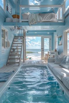 an indoor swimming pool in the middle of a room with stairs leading up to it