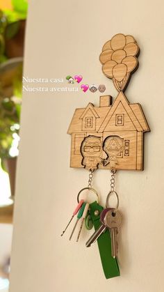 a wooden house key holder with keys attached to it