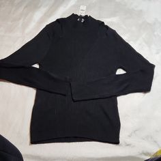 Black Color Black Winter Layering Tops, Black Winter Tops For Layering, Black Sweater For Work In Spring, Black Fall Workwear Tops, Black Tops For Fall Workwear, Trendy Long Sleeve Black Top, Trendy Black Long Sleeve Top, Winter Black Ribbed Top, Black Casual Tops For Fall