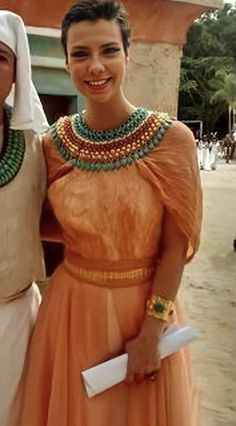 two women dressed in egyptian clothing posing for the camera