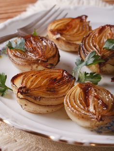 some food is sitting on a white plate