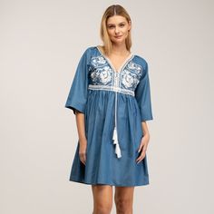 Boho-chic style with a modern accent. This denim mini dress features a spectacular embroidery detail in the chest, as well as romantic oversize french sleeves  and tassels to add more charm to this beautiful dress. Got any cowboy boots? It will be the perfect match! 100% Cotton. Wash Machine  30º ,  Press Medium  Temperature, Do  not  use spin-dry, Do not Bleach Spring Long Sleeve Dress With Embroidered Neckline, Spring Dress With Embroidered Neckline And Long Sleeves, Elegant Spring Denim Mini Dress, Spring Embroidered V-neck Mini Dress, Spring V-neck Dress With Embroidered Sleeves, Spring V-neck Embroidered Mini Dress, Spring Embroidered Midi Dress With Embroidered Sleeves, Cotton Dress With Embroidered Hem For Brunch, Chic Embroidered Mini Dress For Beach