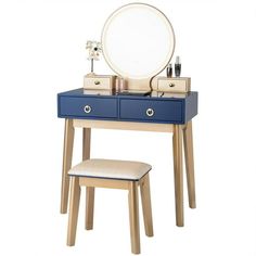 a blue vanity table with a mirror and stool