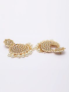 These exquisite gold-toned 2-layer crescent chandbali earrings come with kundan stone studs & beads, are gold-plated, and are secured with a post and back closure. These handcrafted chandbalis can be styled with any ethnic outfit for a dramatic impact, or an evening outfit to complete a dazzling look. Eitherway, complements are all yours! Product color may vary based on the monitor or screen you are using.See FAQ for more details. Size Length: 8.5 cm Details Material: BrassStones: Kundan & Artif Elegant Metal Chandbali Earrings, Metal Chandbali Bridal Earrings, Gold-plated Chandbali Danglers With Pearl Drop, Gold Plated Chandbali Earrings For Diwali, Gold Plated Chandbalis For Diwali, Festive Drop Chandbalis With Pearl Drop, Festive Chandbalis With Pearl Drop, Gold-plated Chandbali Hoop Earrings Bollywood Style, Gold-plated Chandbali Earrings With Stone Work