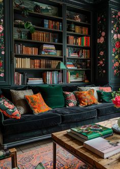 a living room filled with furniture and bookshelves covered in floral wall coverings