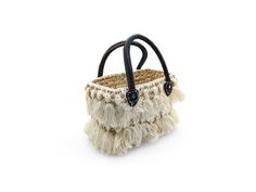 This handmade straw Bag is the ultimate accessory for various occasions, such as bachelorette parties, weddings, and honeymoons. It is also perfect for multiple uses, such as shopping, beach outings, or even corporate meetings. This durable bag features sturdy leather handles and white tassels all around.  Height without the handle: 7 inches | 12 1/2 inches with the handle Length:  10 inches Width: 6 inches Chic White Woven Straw Bag, Chic White Basket Straw Bag, Elegant White Basket Straw Bag, Bohemian White Natural Fiber Bag, White Bohemian Natural Fiber Bag, White Handmade Bucket Beach Bag, White Woven Straw Shopping Bag, White Rectangular Straw Bag For Gift, White Bags In Natural Fiber For Vacation