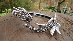 Here is one more version of the famous dragon necklace,this one is a bit cut down, suitable for all those who would like to wear it more often. The dragon necklace in its full glory, the magnificent silver dragon choker for women or men, a true special occasion gift. It can also be used as a part of a costume for girls in cosplay. It is hand modeled in wax and cast using standard jewelry making methods, never loses color and never causes skin rashes or reactions, it is in a way eternal. It can b Dragon Choker, Skin Rashes, Costume For Girls, 3d Dragon, Witch Shop, Witchy Crafts, Dragon Necklace, Silver Dragon, Hand Model