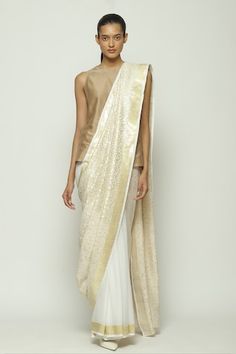 Ivory silk saree with all metallic woven circular pattern and contrast border details. - Aza Fashions White Cotton Silk Pre-draped Saree With Zari Work, Elegant Pre-draped Saree With Mirror Work In Cotton Silk, Elegant Cotton Silk Pre-draped Saree With Mirror Work, Elegant Pre-draped Cotton Silk Saree With Mirror Work, White Pre-draped Cotton Silk Saree With Resham Embroidery, White Silk Saree For Reception, White Cotton Silk Pre-draped Saree For Wedding, White Silk Pre-draped Saree With Resham Embroidery, Elegant Off White Pre-draped Saree With Zari Work