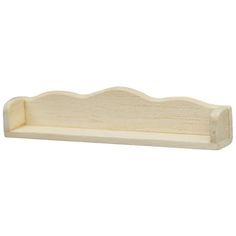 a wooden shelf that has been carved into the shape of a wave and is white