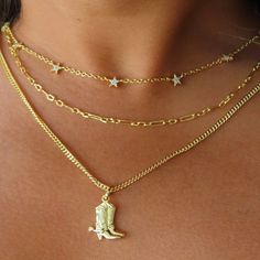 Saddle up in style with our Giddy Up Necklace! Featuring a charming cowboy boot pendant and a dazzling hand-set Cz stone, this necklace is perfect for any cowgirl looking to add some flair to their outfit. Giddy Up, Cowgirl Necklaces, Cowgirl Look, Cow Girl, Cowboy Boot, Cz Stone, Silver Necklaces, Cowboy Boots, Saddle