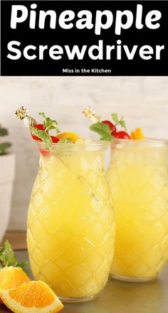 pineapple screwdriver drinks in mason jars with garnishes