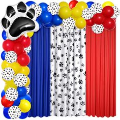 an image of balloons and decorations for a dog themed party