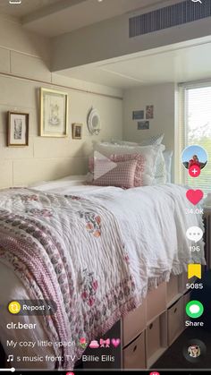 a bed with white sheets and pink pillows