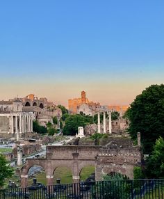 the ruins of ancient rome are seen in this view from across the cemetery's fence