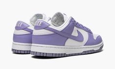 The Women’s Nike Dunk Low Next Nature “Lilac” is a women’s-exclusive colorway of the vintage basketball shoe made from at least 20% recycled content by weight.  The eye-pleasing “Lilac” colorway was released as part of the “Move to Zero” campaign by Nike that aims to reduce the brand’s carbon footprint.  The shoe features a white leather base with Lilac-colored leather overlays and Swoosh branding.  White “Nike” embroidery appears on the heel.  Lilac “Nike” and Swoosh detailing can be found on t Purple Lace-up Sneakers With Gum Sole, Purple Sneakers With Rubber Sole For Streetwear, Lavender Sporty Sneakers With Round Toe, Sporty Lavender Sneakers With Round Toe, Purple Sporty Sneakers With Vulcanized Sole, Sporty Purple Sneakers With Gum Sole, Purple Low-top Sneakers With Gum Sole, Lavender Low-top Sneakers For Streetwear, Lavender Lace-up Sneakers With Boost Midsole