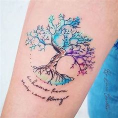 a tattoo with a tree on the arm and words written below it that says, you are family