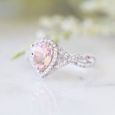 Beautiful Infinity Pear Morganite Ring Made of Solid Sterling Silver (S925), Accented with Cubic Zirconia Stone Cut: Pear/Teardrop Gem size: 8.0 x 6.0 mm Carat Weight: 1.25 ct. (approx.) Stone Creation: Created Morganite Handling time: 1-2 business days Free domestic shipping. Usually takes 2-5 business days. Wrapped & ready to give in a beautiful box. Morganite Teardrop Wedding Jewelry, Teardrop Morganite Wedding Jewelry, Morganite Teardrop Jewelry For Wedding, Morganite Pear-shaped Wedding Rings, Pear-shaped Morganite Wedding Ring, Classic Pink Wedding Rings, Pink Teardrop Anniversary Ring, Pink Pear-shaped Anniversary Rings, Pink Halo Ring For Anniversary