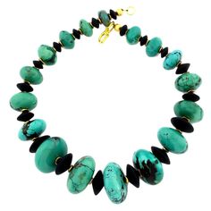 Extraordinary highly polished 17 inch long graduated natural glowing American Turquoise handmade necklace. The focal point gemstone is 32.7mm. These luscious Turquoise rondells are enhanced with flat black Onyx and gold tone accents and clasp in this unique handmade necklace.. Handmade Pearl Jewelry, Black Onyx Jewelry, Beautiful Beaded Jewelry, Glowing Necklace, Turquoise And Black, Black Onyx Necklace, Vintage Beads Necklace, Onyx Jewelry, Onyx Necklace