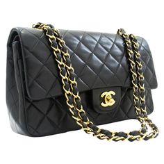 CHANEL Classic Double Flap 10" Chain Shoulder Bag Lambskin Black Pre owned Vintage Black Color Code ID 3412732 Interlocking CC Logo & Quilted Pattern Gold-Tone Hardware Chain-Link Shoulder Straps Single Exterior Pocket Leather Lining & Four Interior Pockets Turn-Lock Closure at Front with CC logo The coveted "Must have" Chanel Timeless 10 inch double flap shoulder bag in Black quilted lambskin leather, gold metal trim, golden metal chain interlaced with beige leather for a shoulder or crossbody carry Patch pocket on the back of the bag Flap closure, golden CC logo clasp Double flap Zip on the bottom flap Patch pocket at front of bag Inner lining in beige leather, 1 double patch pocket, 1 lip liner Signature : "Chanel Paris Made in France” Date: 1988 Dimensions: 23x15x6 cm (10x5,9x2,3 Inche Medium Classic Chanel Bag, Channel Purse, Logo Vintage, Quilted Pattern, Chanel Vintage, Chanel Paris, Cc Logo, Chain Shoulder Bag, Classic Flap