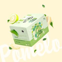 an open box of green tea next to sliced lemons and leaves on a yellow background