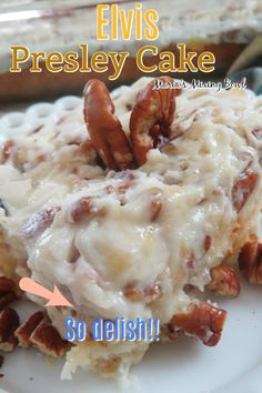 a close up of a plate of food with pecans on top and the words elvis presley cake above it