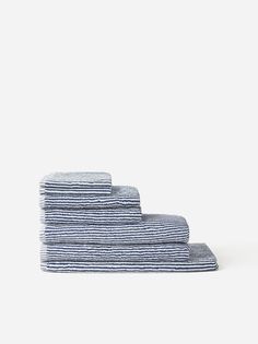 three folded towels sitting on top of each other