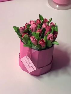 there is a pink box with flowers in it